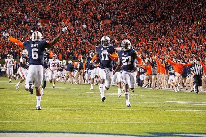 Auburn players celebrate a win at the 2013 Iron Bowl 